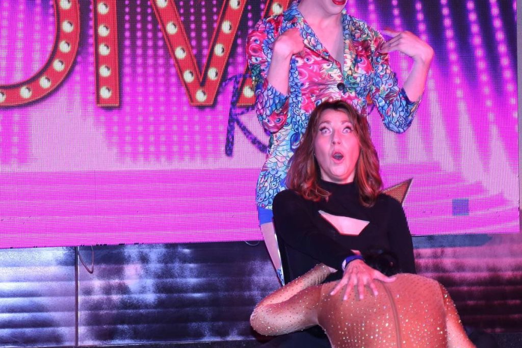 a woman sitting on a stage